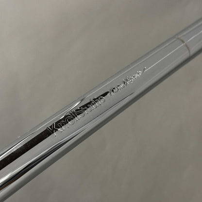 Close-up of chrome-plated steel tube with Knoll Breuer engraving on Knoll Breuer Laccio side table frame