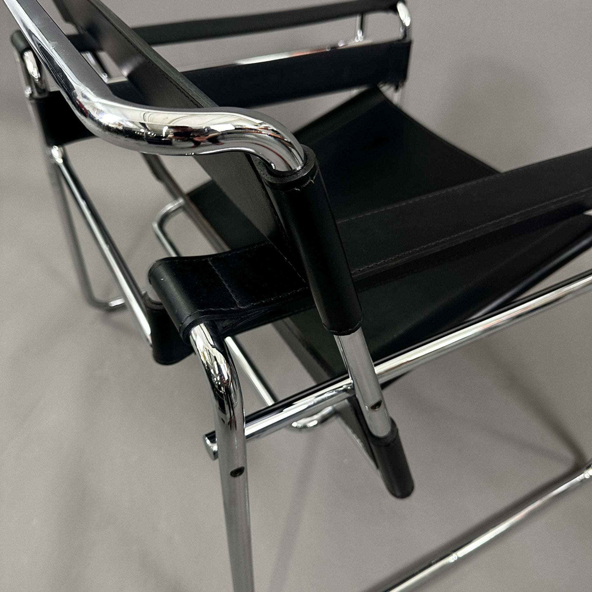 Close-up of black leather and chrome Knoll Wassily Chair with tubular steel frame