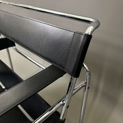 Close-up of Knoll Wassily Chair with black leather straps and chrome frame detailing