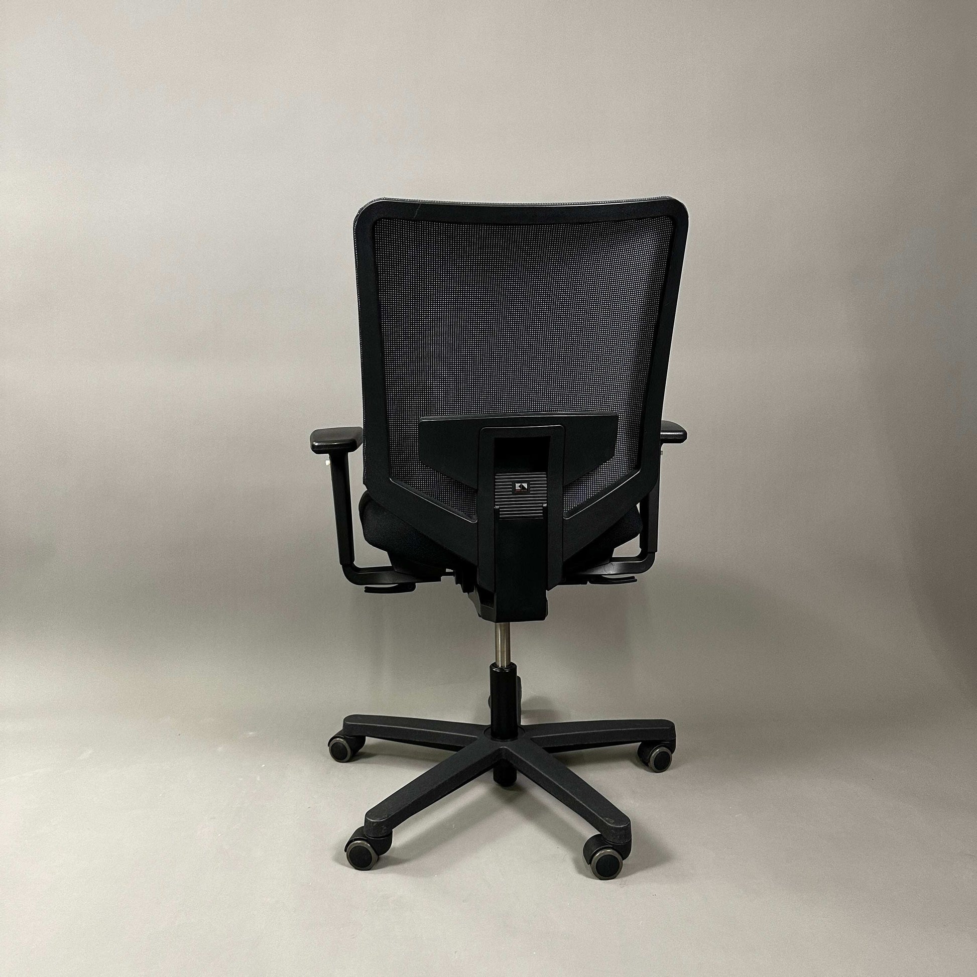 König & Neurath Jet ergonomic black office chair with mesh back and adjustable armrests viewed from the rear