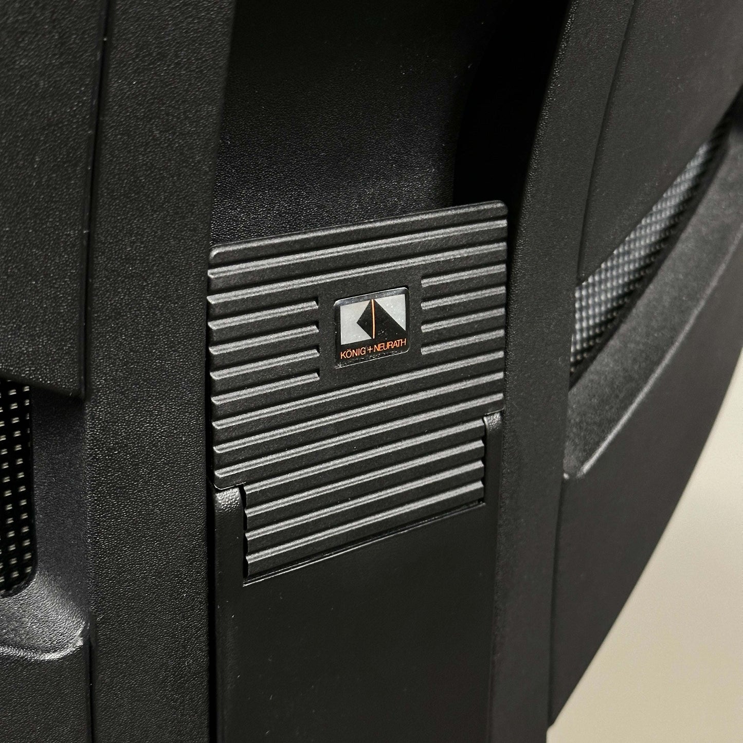 Close-up of König & Neurath Jet ergonomic office chair adjustment mechanism in black design