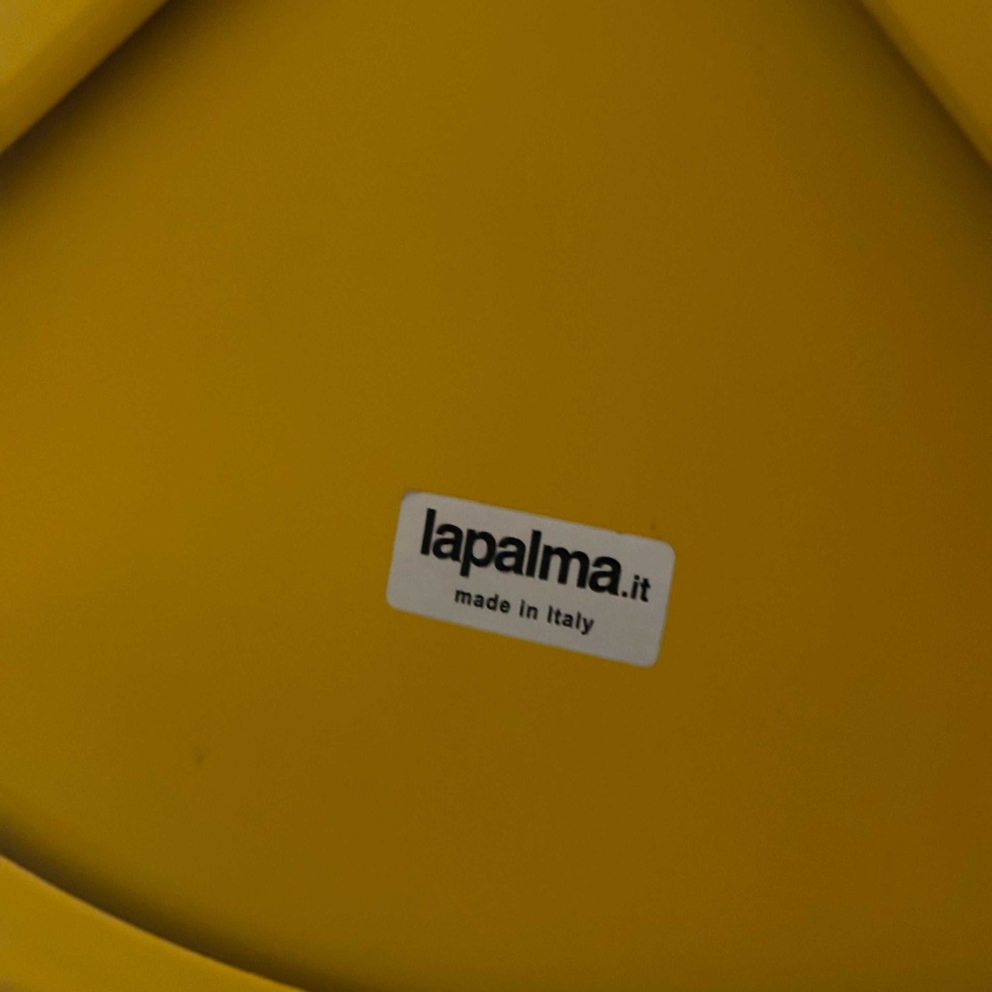 Close-up of yellow LaPalma Barhocker STIL S49 seat with brand label made in Italy