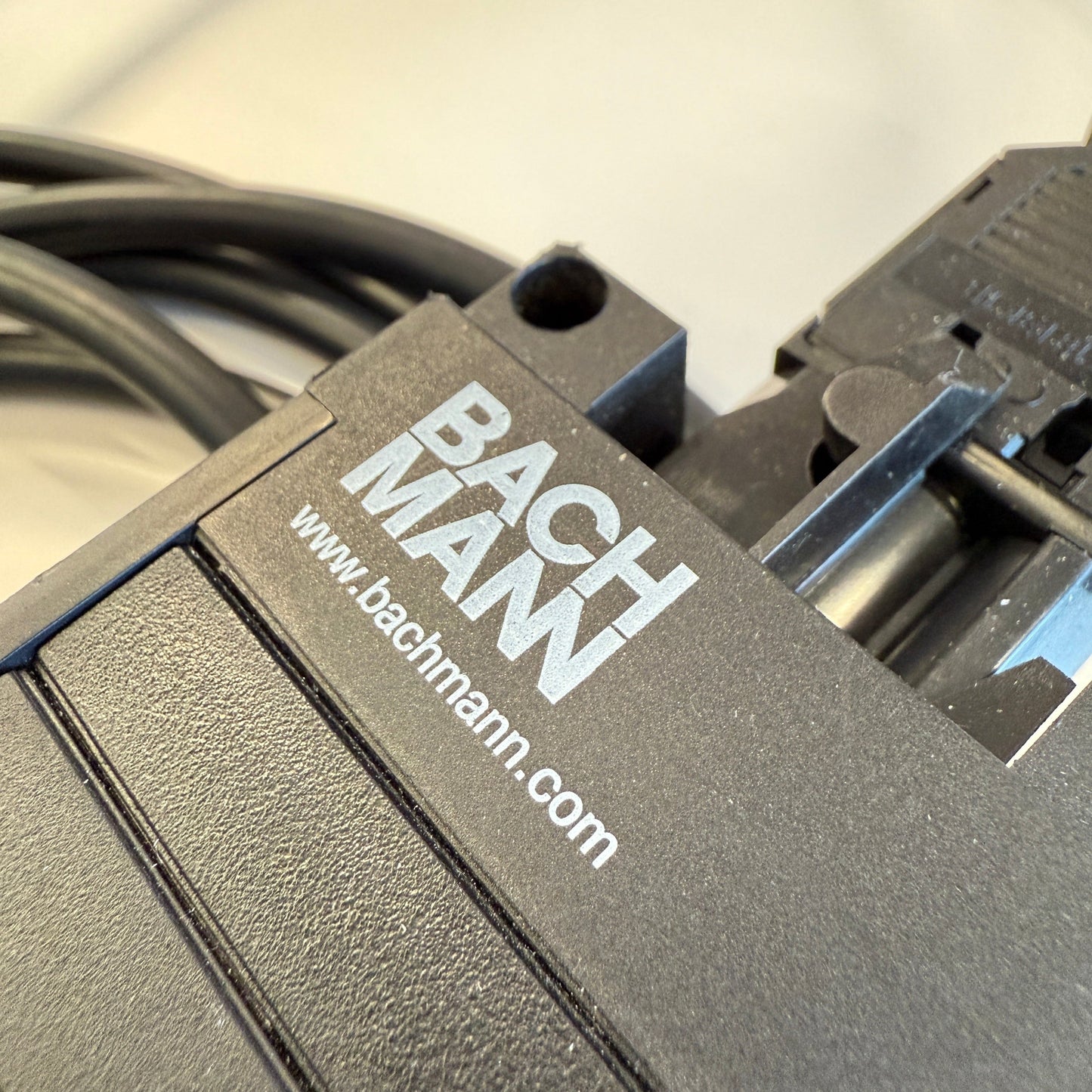 Black Bachmann Mehrfachsteckdose power strip with four protective sockets and integrated cable
