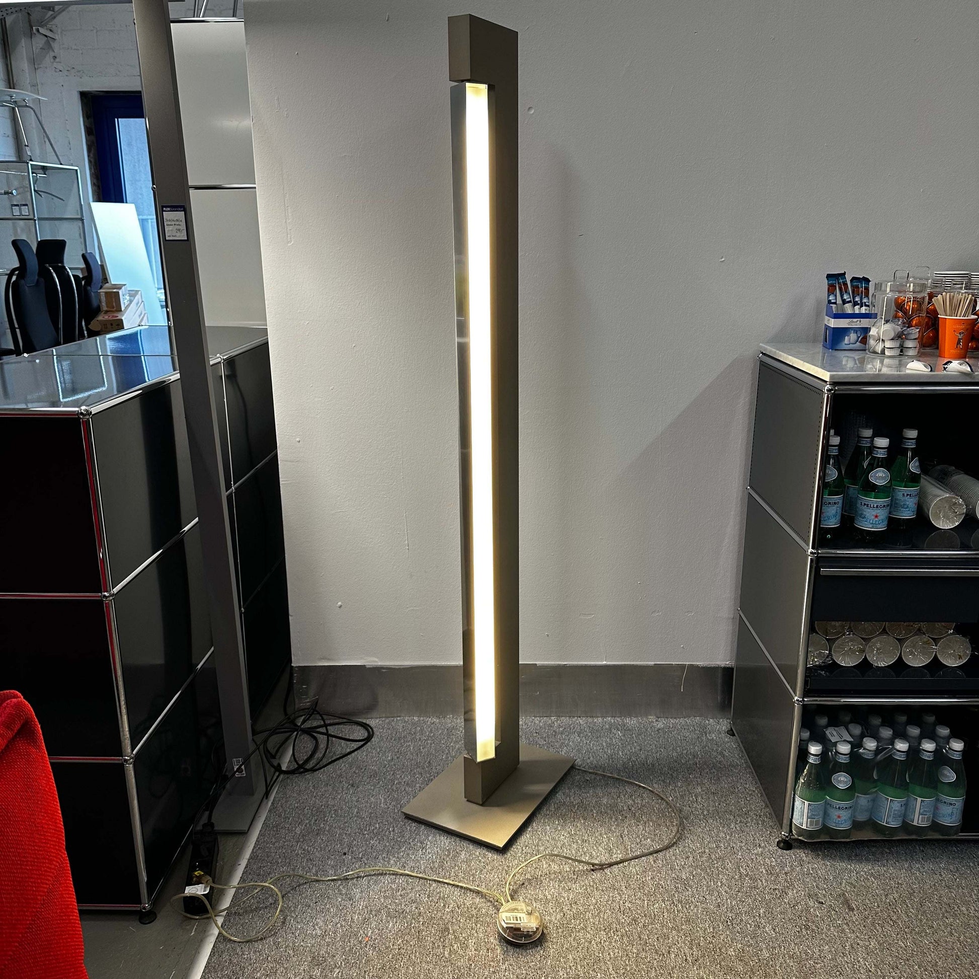 Nemo Lighting Modell ARA floor lamp with halogen light and champagne lacquered aluminum finish in a modern interior setting