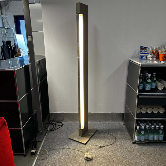 Nemo Lighting Modell ARA floor lamp with halogen light and champagne lacquered aluminum finish in a modern interior setting
