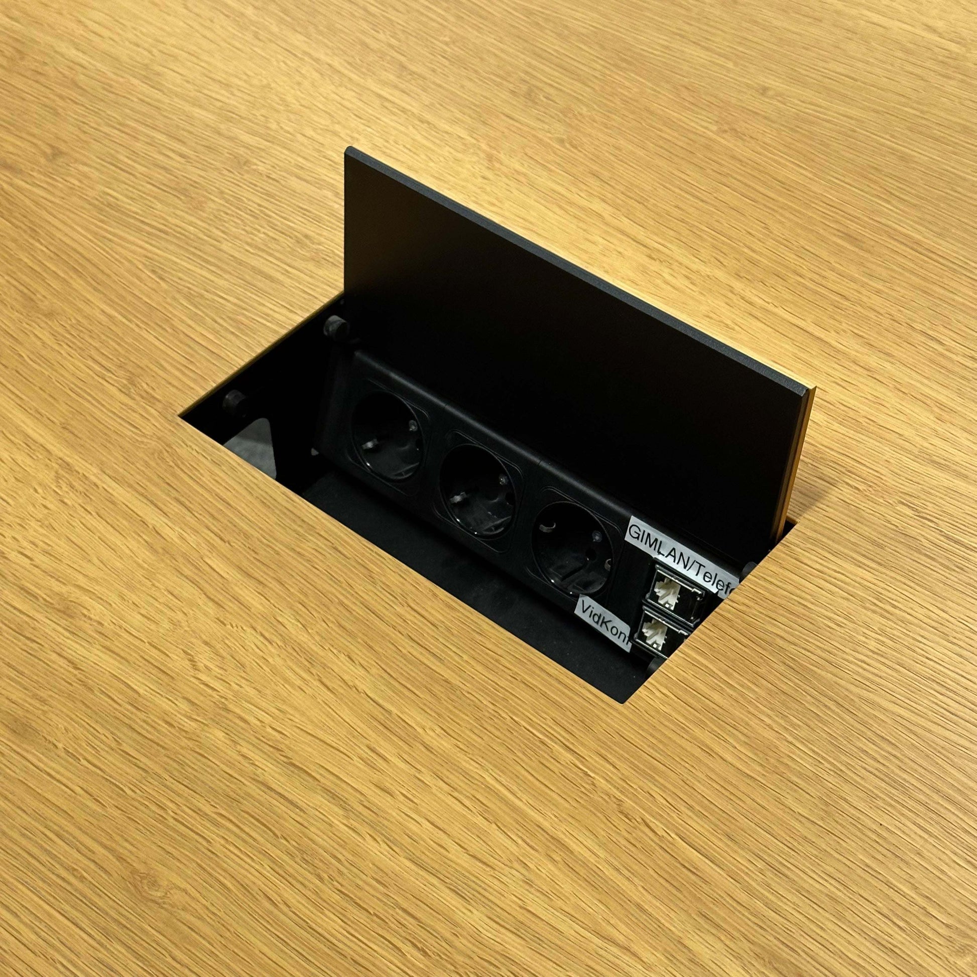 Renz Konferenztisch conference table with built-in power outlet and USB ports on wooden surface