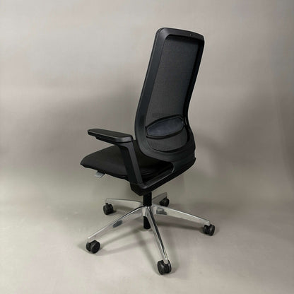 Black SEDUS se:flex ergonomic office chair with adjustable seat height, 3D armrests, lumbar support, and mesh backrest on caster wheels