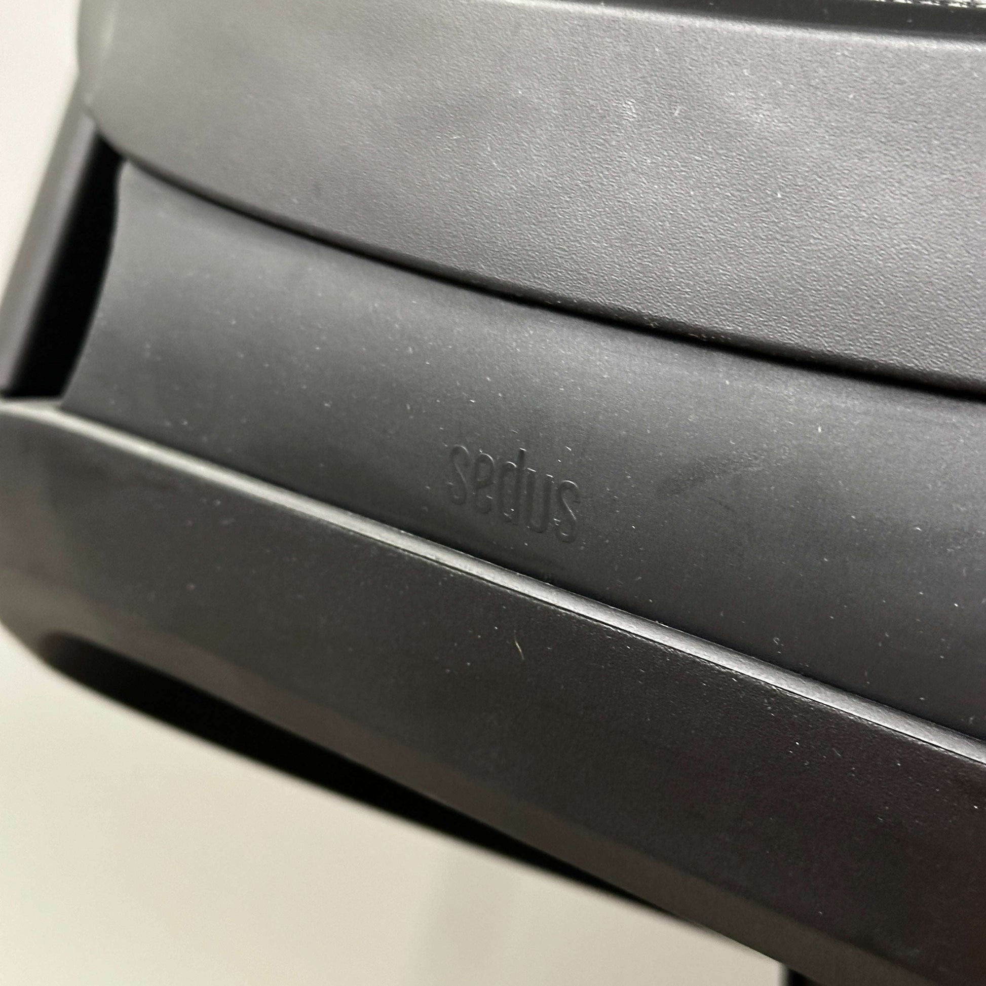 Close-up of black SEDUS se:flex office chair with adjustable ergonomic features and solid build quality