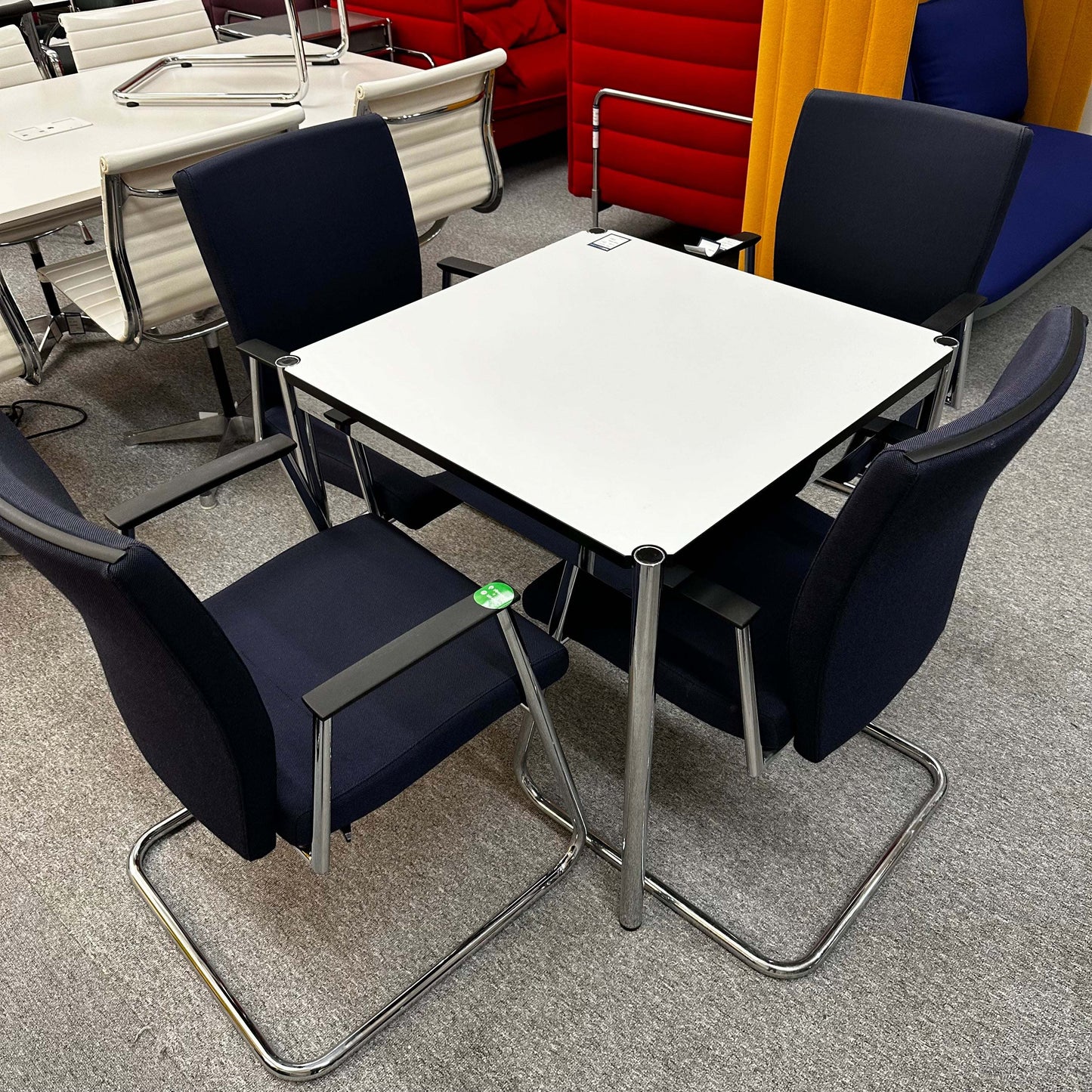 Sedus Freischwinger modern office chairs with ergonomic design around white square table