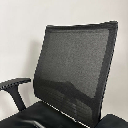 Sedus Open Up office chair with black mesh backrest, black leather seat, and polished aluminum base