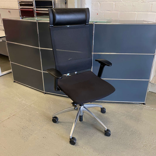Sedus open up black office chair with aluminum base, adjustable armrests, leather headrest, and mesh backrest.