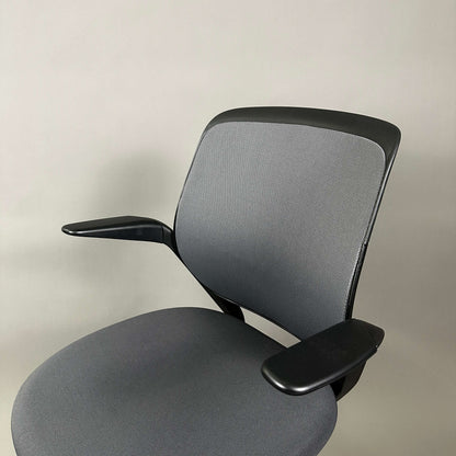 Steelcase Cobi ergonomic office chair with black frame, graphite fabric seat, and mesh backrest, adjustable height 54-79cm.