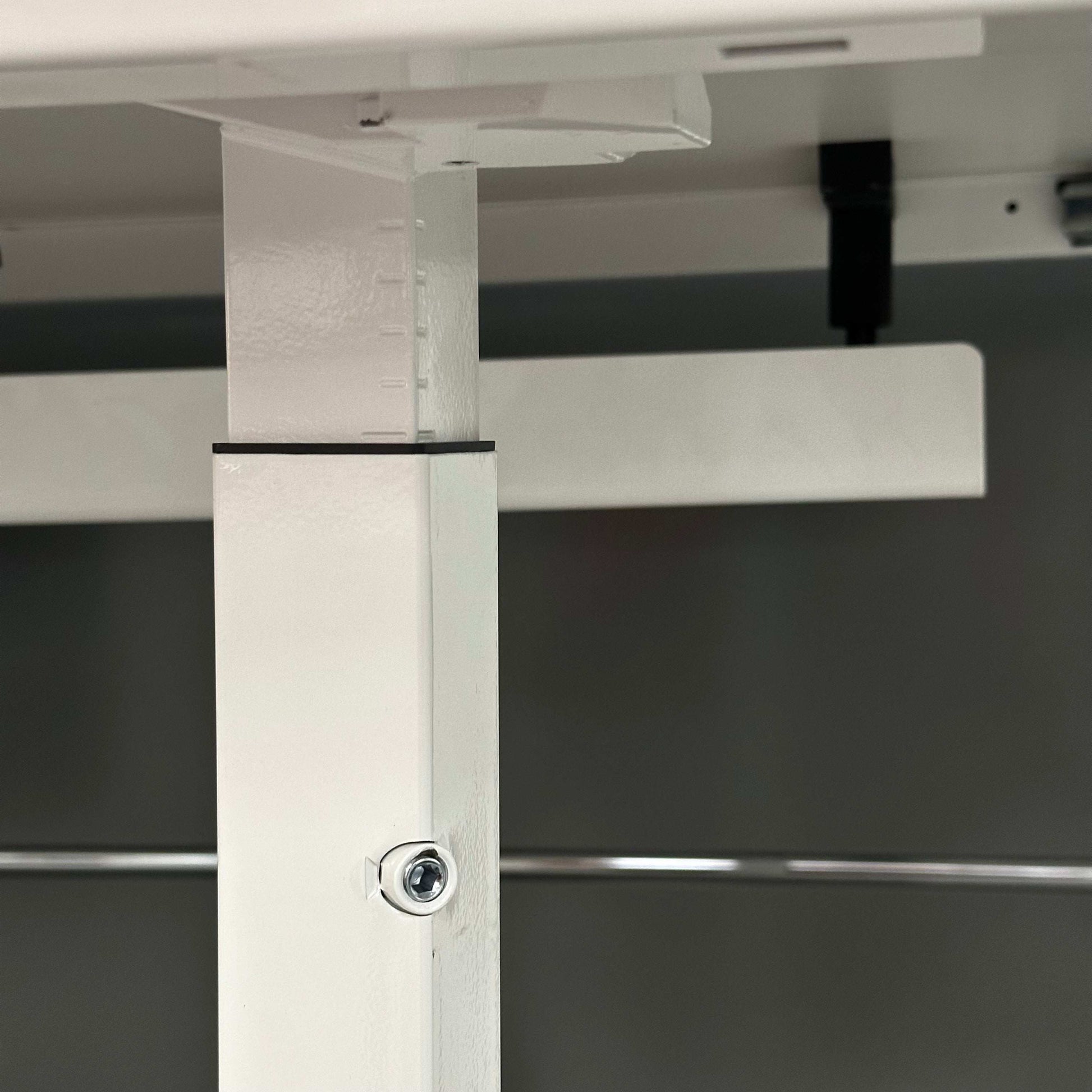 Close-up of Steelcase Kalidro adjustable white desk leg with manual height adjustment and cable management channel