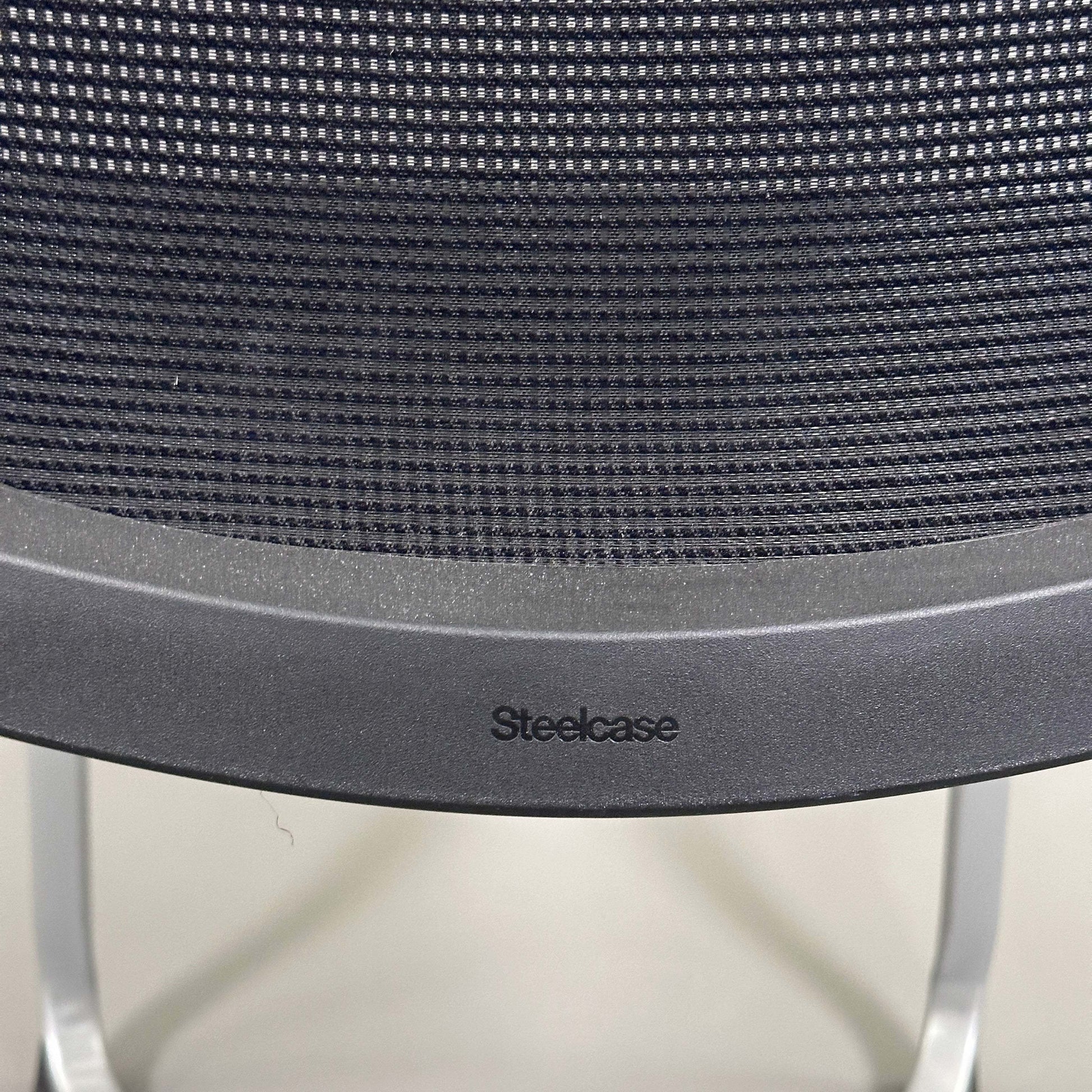 Steelcase Northside black mesh back meeting chair with silver frame and stackable design