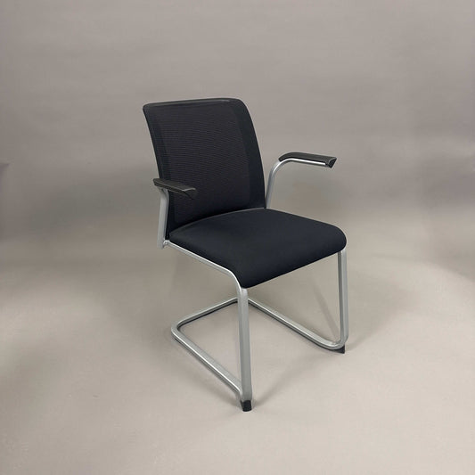 Steelcase Northside meeting chair with black mesh back and silver frame, stackable office chair