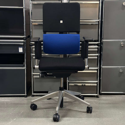 Ergonomic Steelcase Please office chair with black and blue cushions and adjustable armrests on a five-wheel base