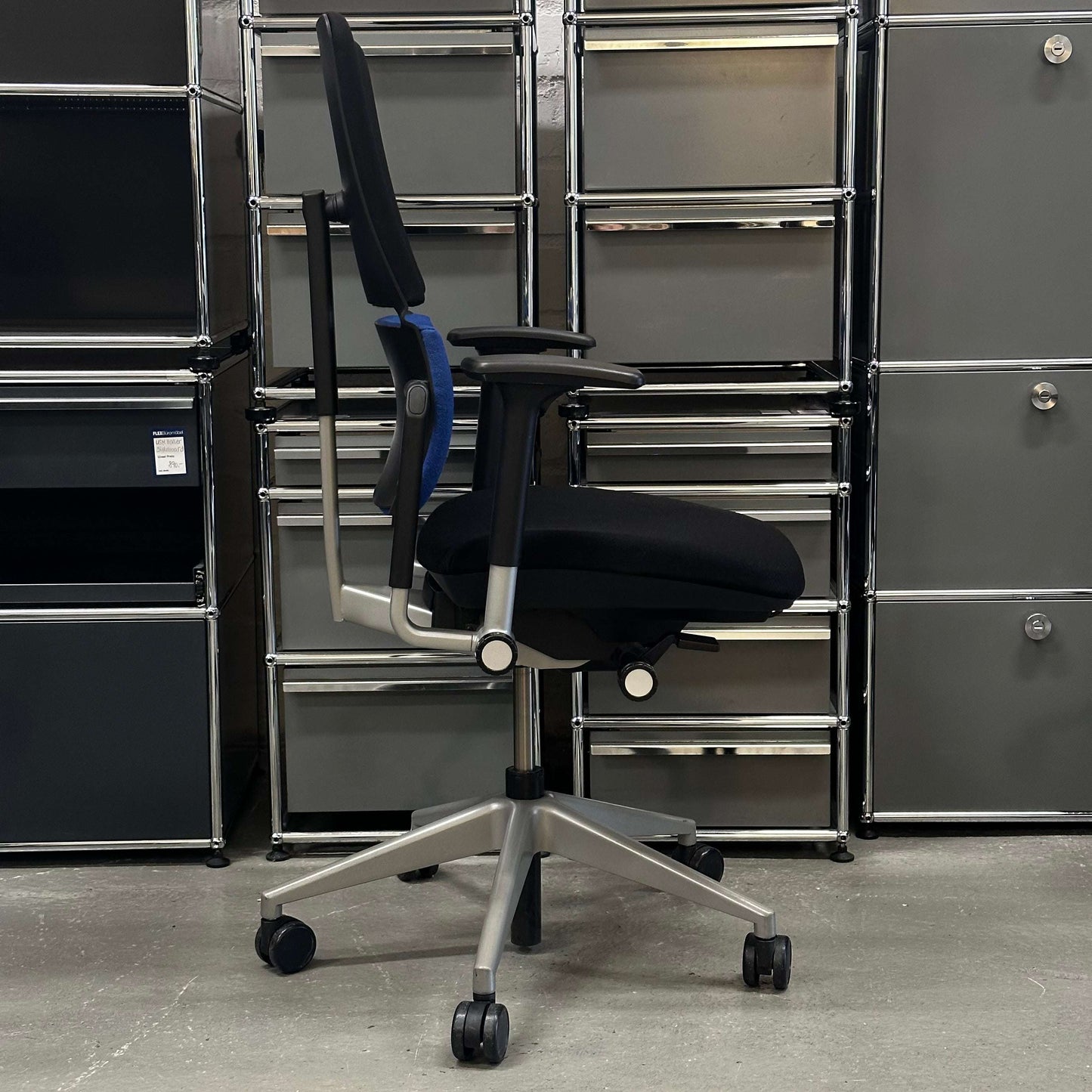 Steelcase Please ergonomic office chair with adjustable features and modern design in black and blue