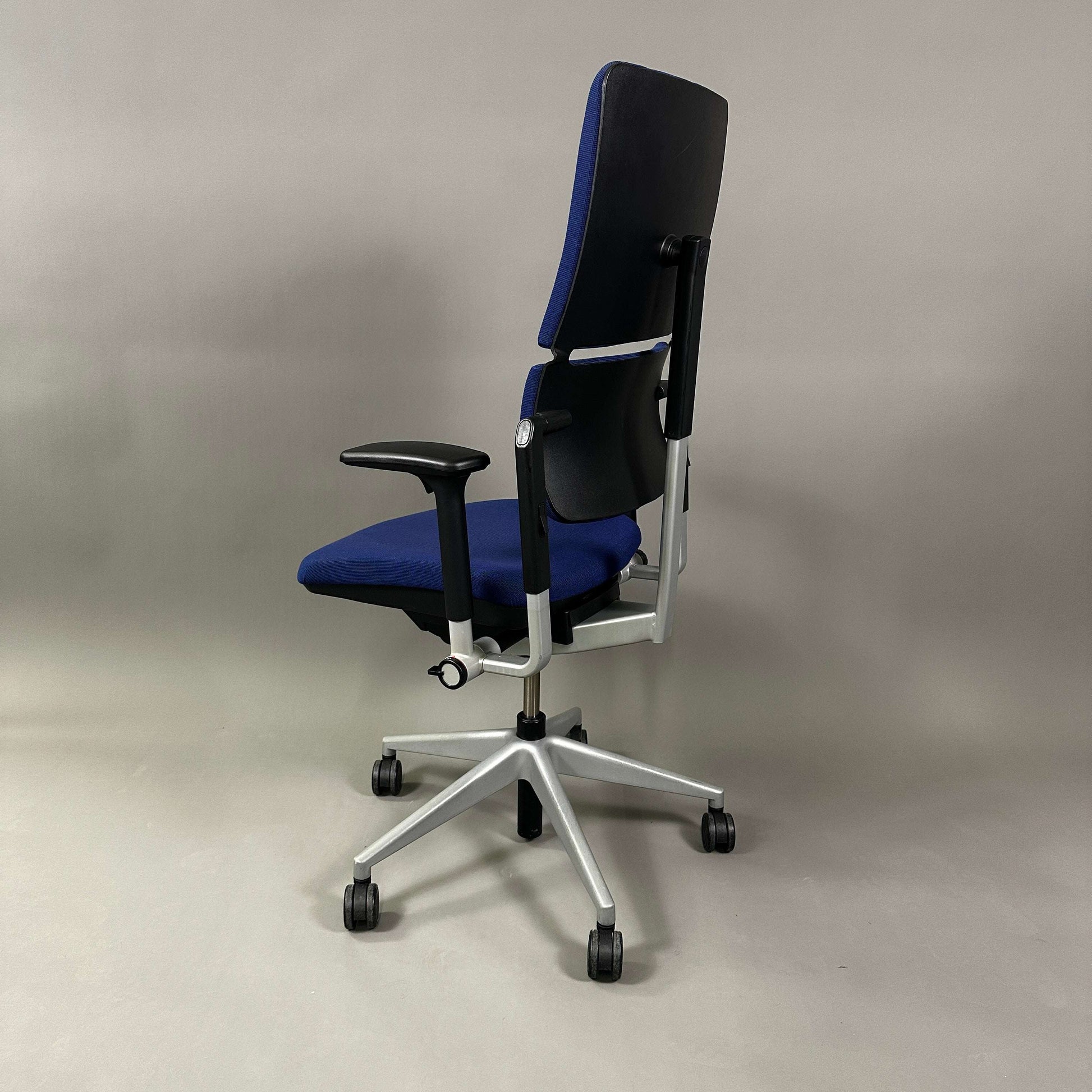 Steelcase Please ergonomic office chair in blue with adjustable height, armrests, and lumbar support on silver metal frame