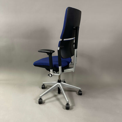 Steelcase Please ergonomic office chair in blue with adjustable height, armrests, and lumbar support on silver metal frame