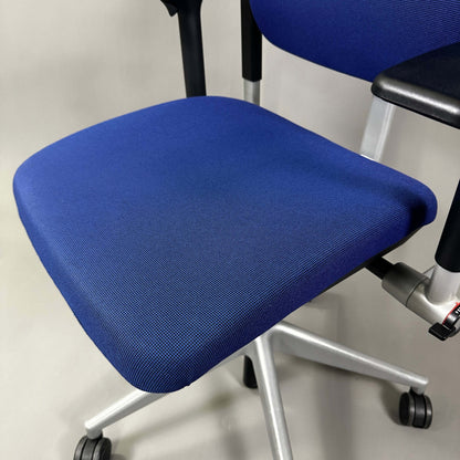 Steelcase Please blue ergonomic office chair with adjustable features and silver metal frame