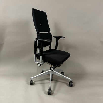 Steelcase Please V2 ergonomic office chair in black with silver base and adjustable features