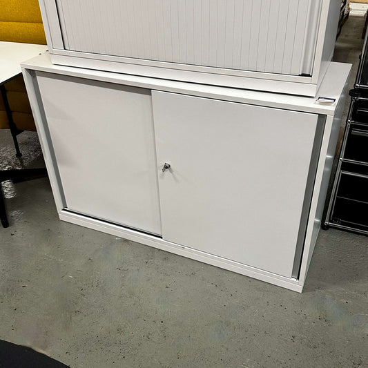 White Steelcase Sideboard 2OH with 120cm width and sliding doors in office setting