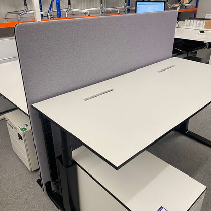 Office workspace with gray Stellwand room divider, 180x140 cm, providing sound and visual protection