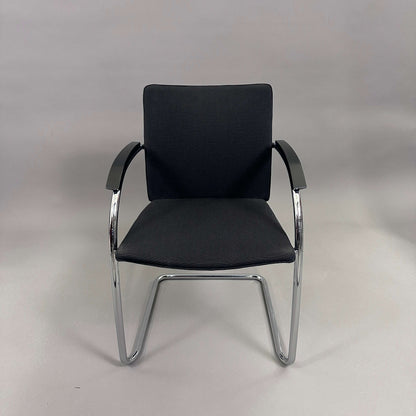 Thonet S78/S79 chair with black upholstery, matte black wooden armrests, and chrome frame