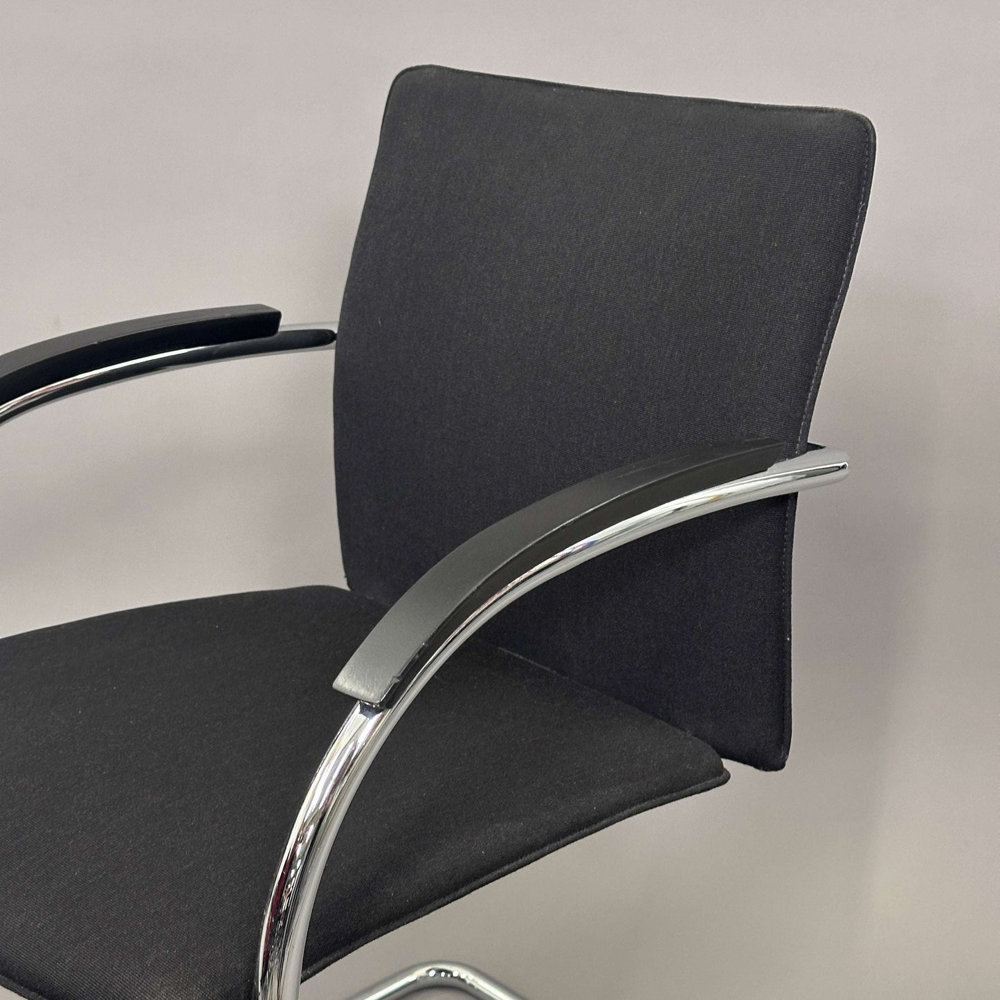 Thonet S78/S79 chair with black upholstery, matte black wooden armrests, and chrome frame
