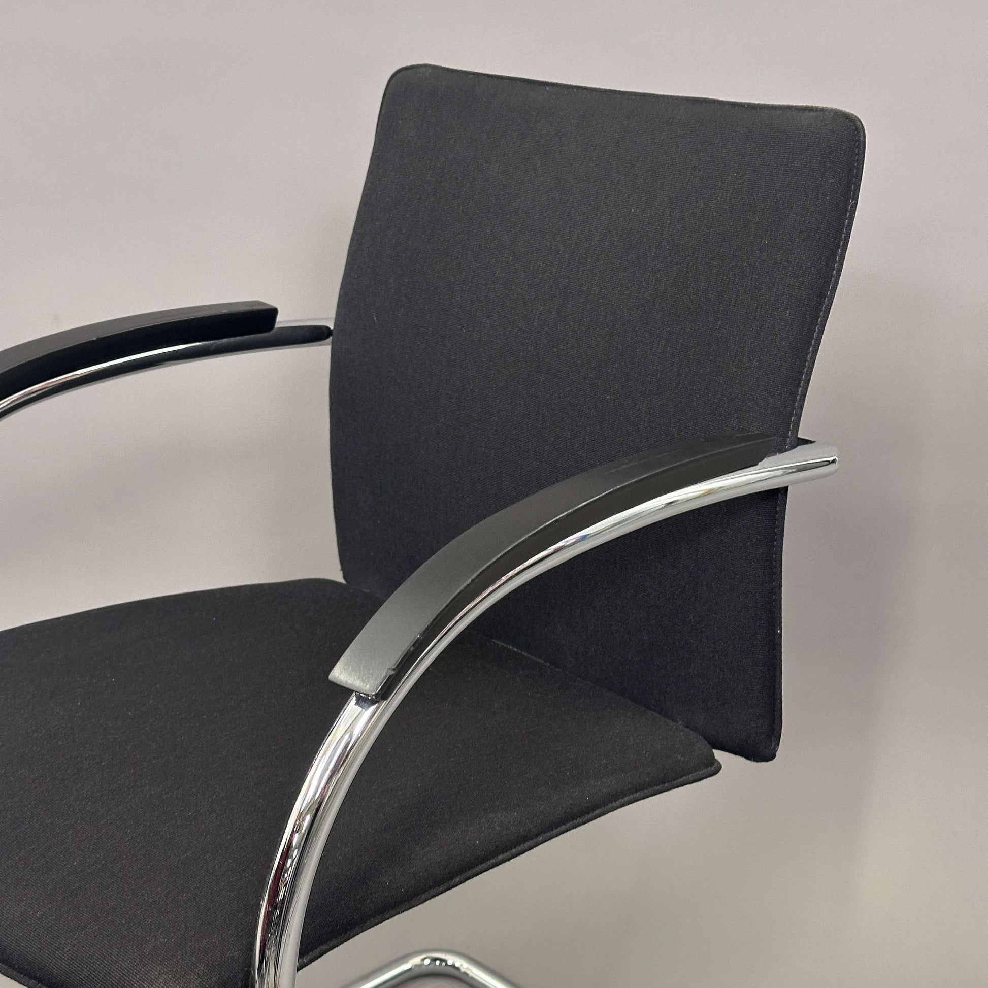 Thonet S78/S79 chair with black upholstery, matte black wooden armrests, and chrome frame