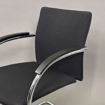 Thonet S78/S79 chair with black upholstery, matte black wooden armrests, and chrome frame