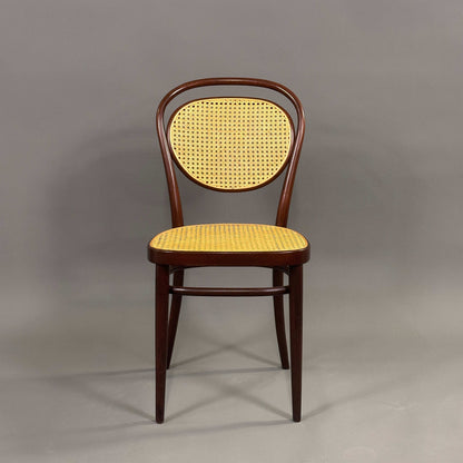 Thonet Stuhl 215r aus Bugholz in dunkelbraun mit naturfarbenem Korbsitz und -lehne, klassisches Design um 1900, in ausgezeichnetem Zustand