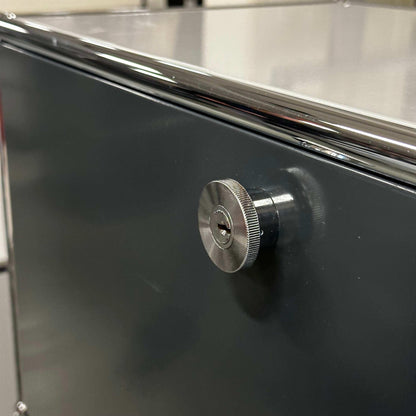 USM Haller High Board in light gray and anthracite with metal locking knob close-up