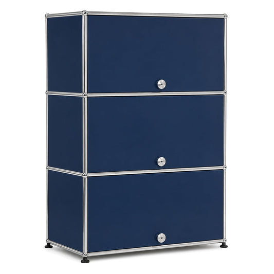 USM Haller Highboard in Stahlblau mit drei Einschubtüren und verchromtem Metallrahmen, 77x109x38 cm.