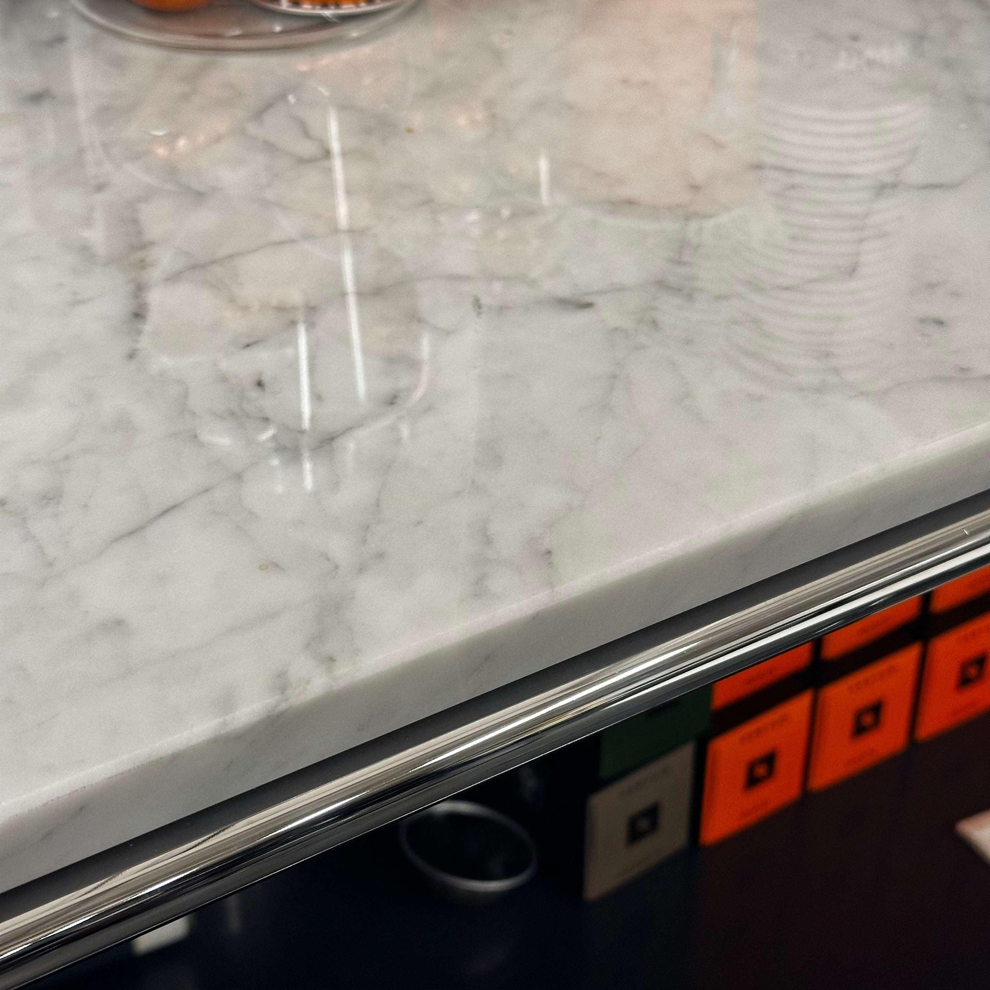 Close-up of USM Haller Highboard with white marble top and anthracite frame