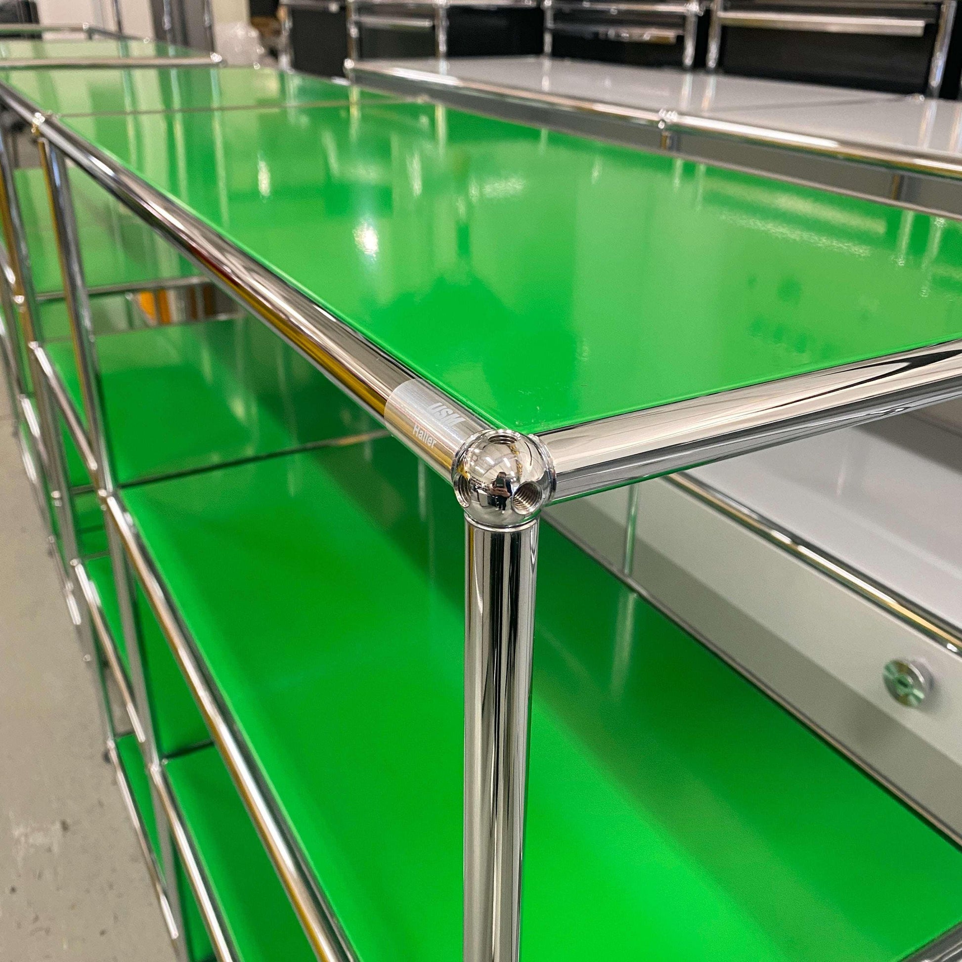 USM Haller Highboard in green with chrome frame, 2x3 open shelves, measuring 128x109x38 cm