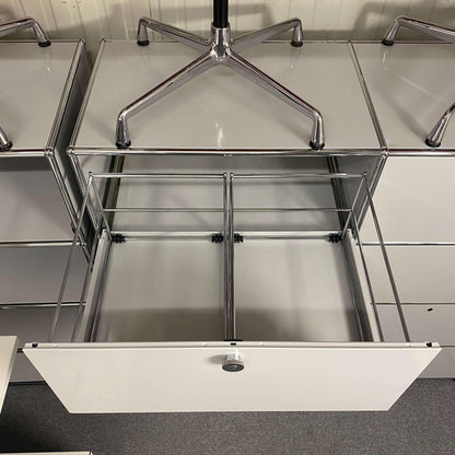 USM Haller Highboard in light gray with open hanging file drawer and metal frame