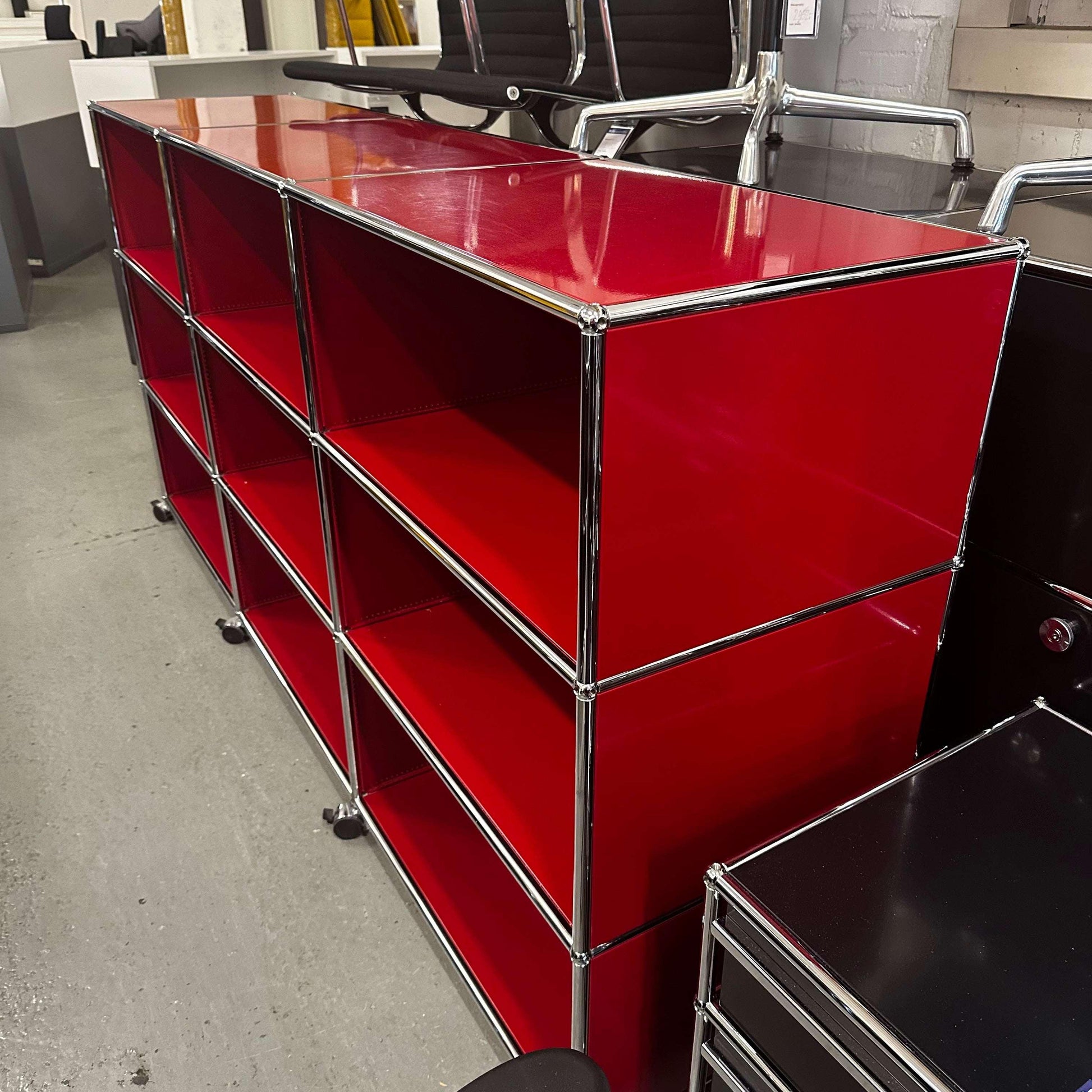 USM Haller Highboard in red with 9 open compartments, 50cm depth, and lockable caster wheels