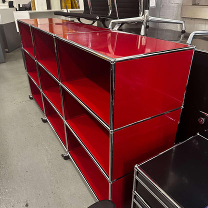 USM Haller Highboard in red with 9 open compartments, 50cm depth, and lockable caster wheels