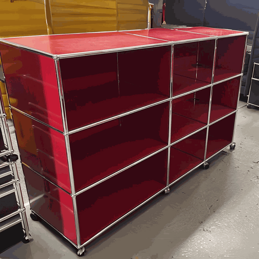 USM Haller Highboard in red with 9 open compartments and lockable caster wheels