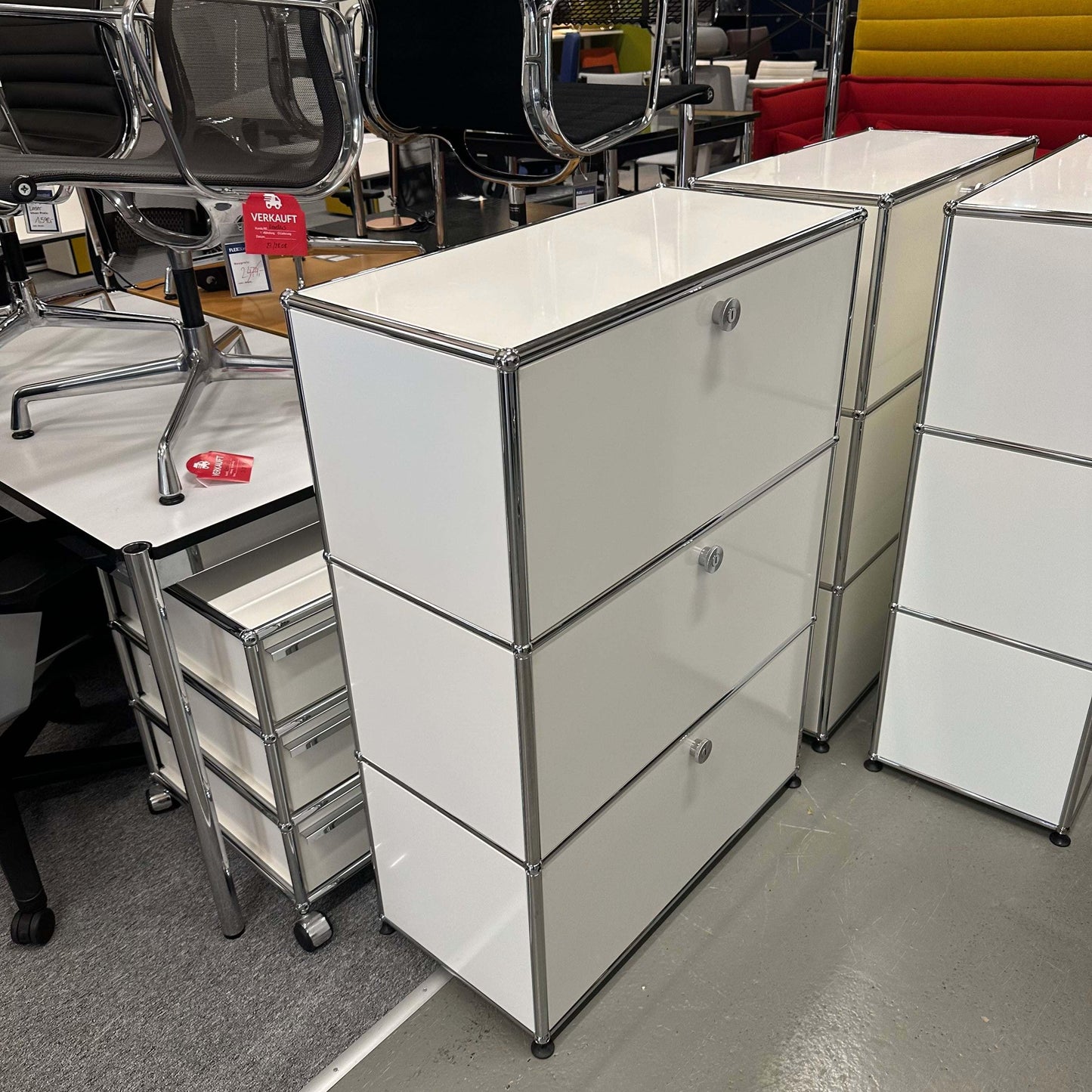 White USM Haller Highboard with three flap doors and 35cm depth in an office setting