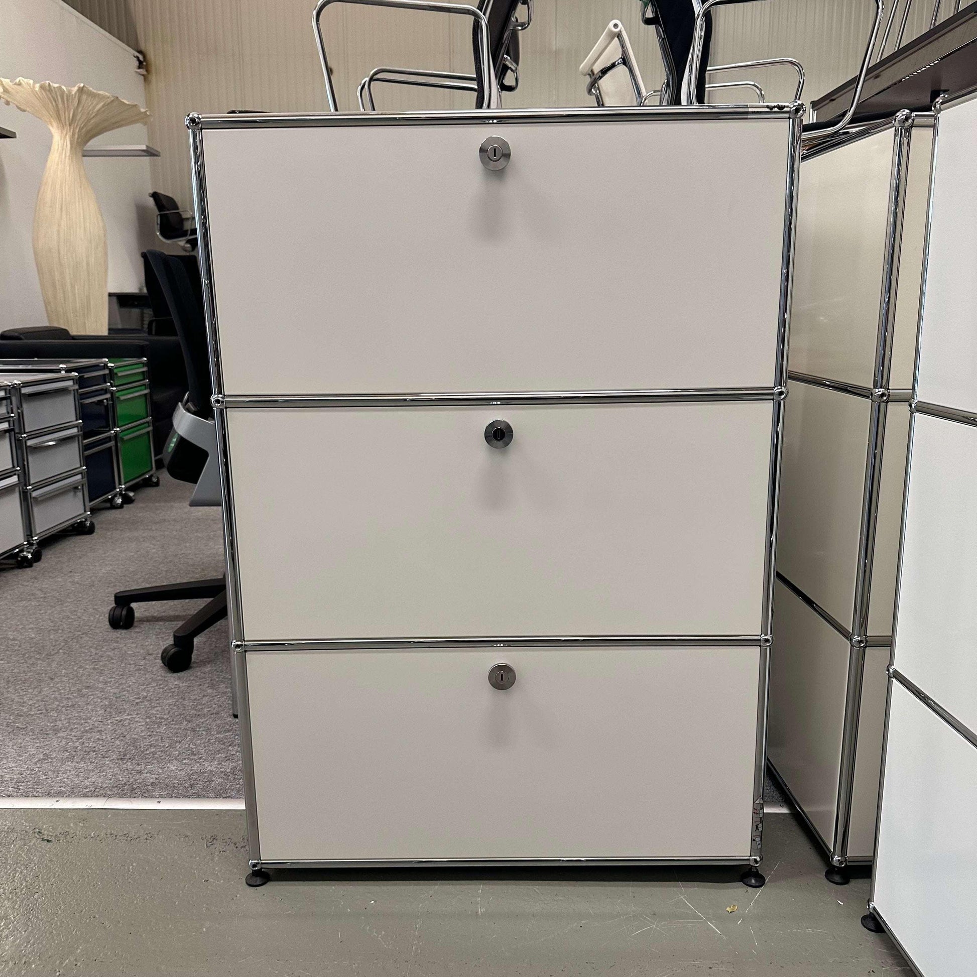 White USM Haller Highboard with three flap doors and 35cm depth in office setting