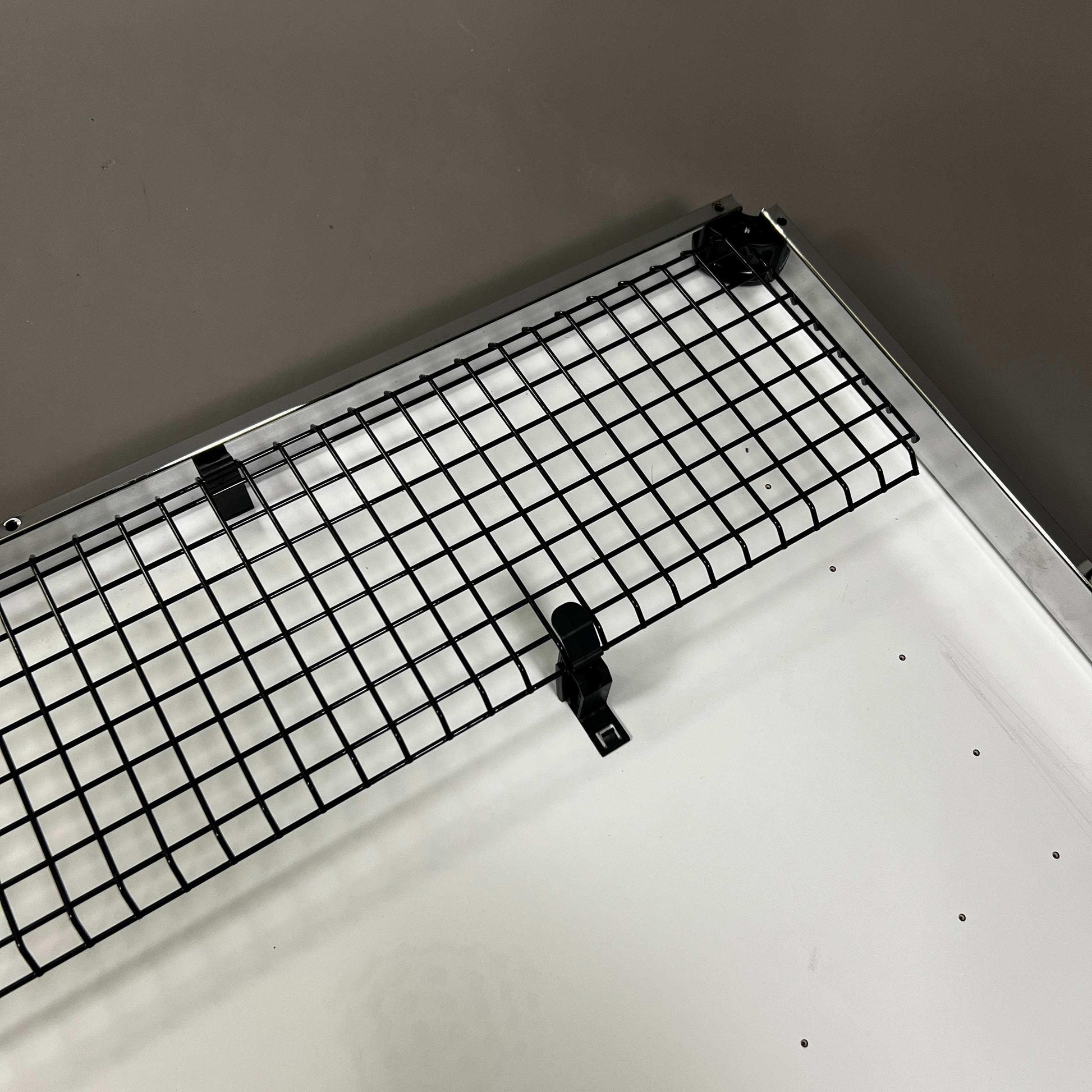 USM Haller Kabelkorb foldable black metal cable organizer mounted under desk for cable management
