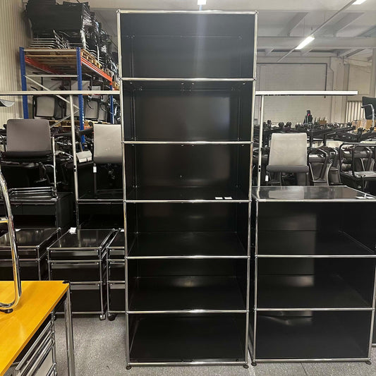 USM Haller Regal in graphite black with 1x6 compartments, 77x214x52cm, displayed in a warehouse setting.