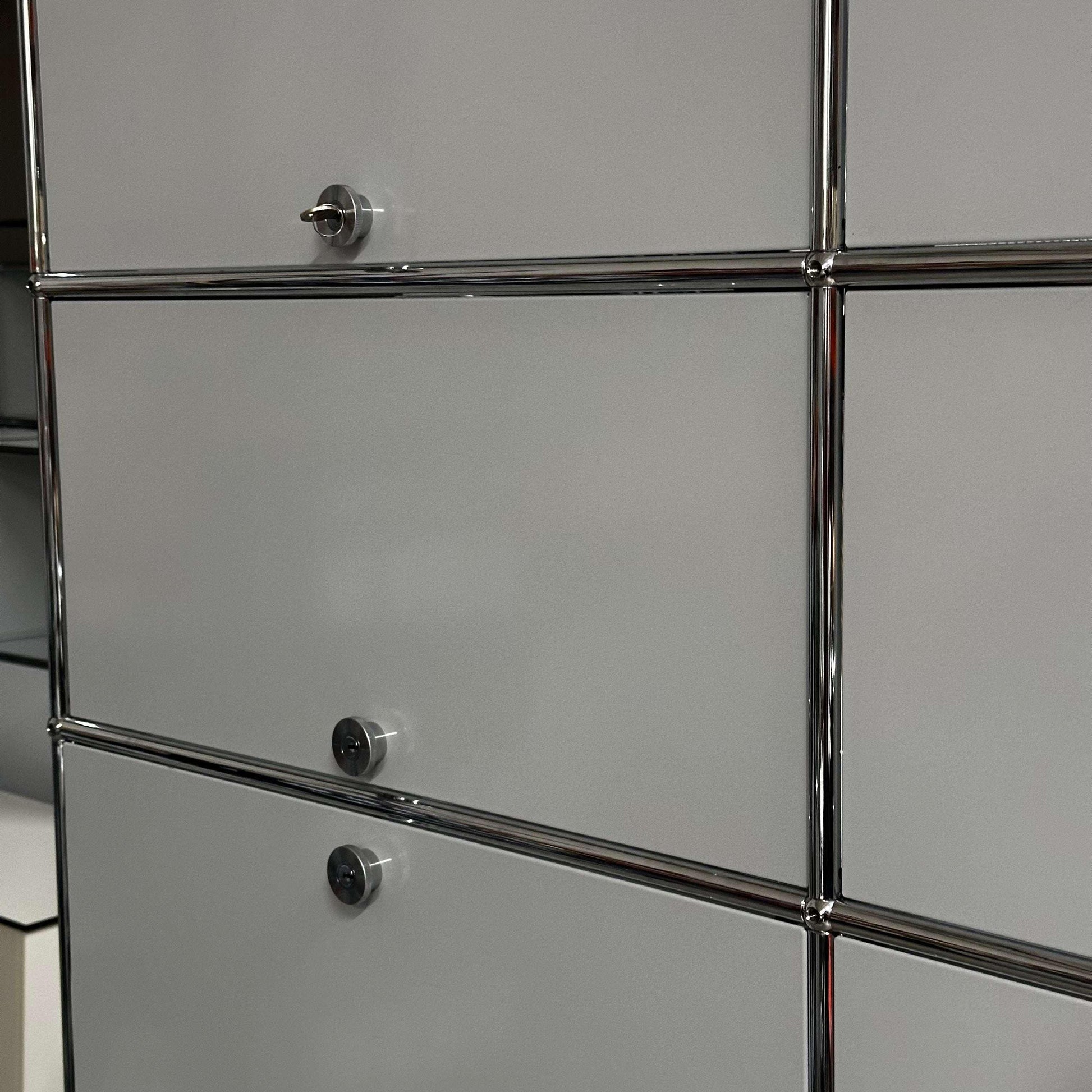 USM Haller Regal light gray large steel storage cabinet with chrome frame and lockable doors