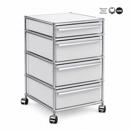 USM Haller Rollcontainer mit 4 lichtgrauen Schubladen, Chromgestell und Rollen.