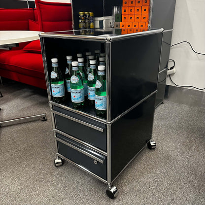 USM Haller Rollcontainer in black and anthracite with two drawers and one compartment on wheels