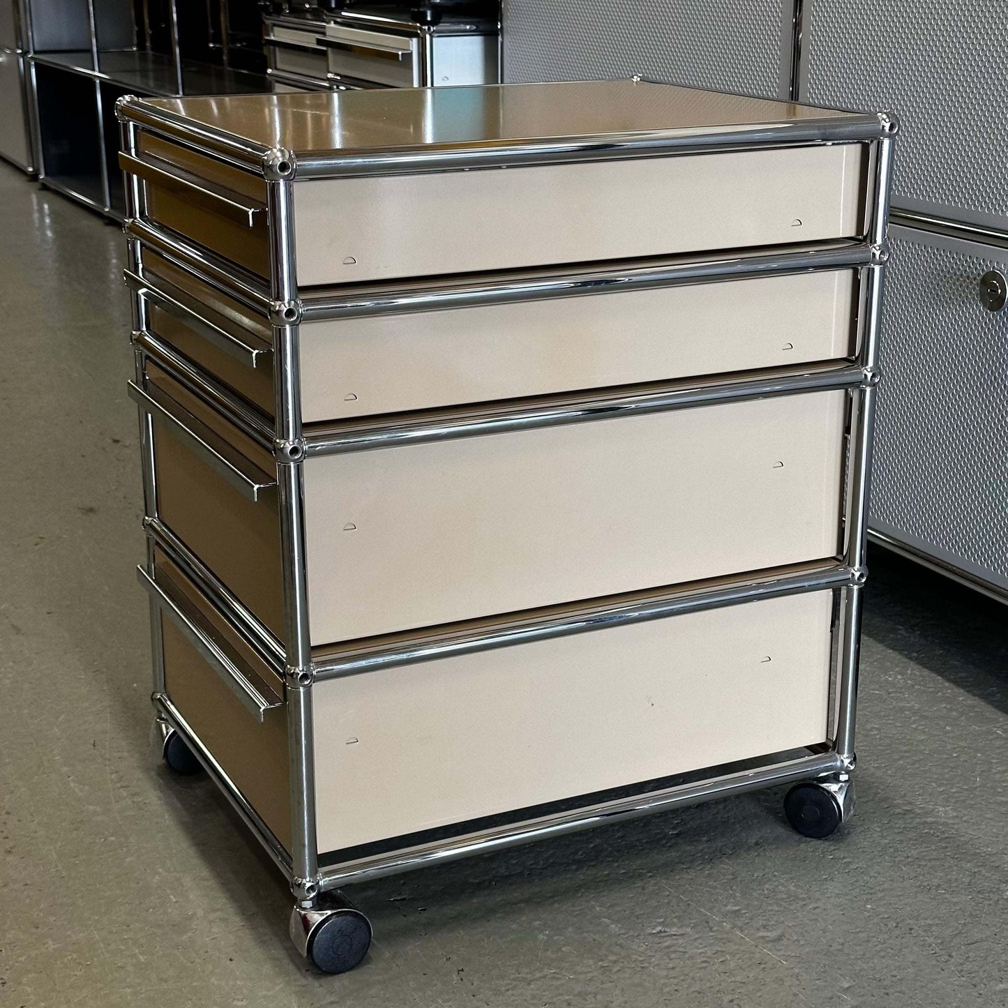 USM Haller beige rollcontainer with four drawers and chrome frame on wheels