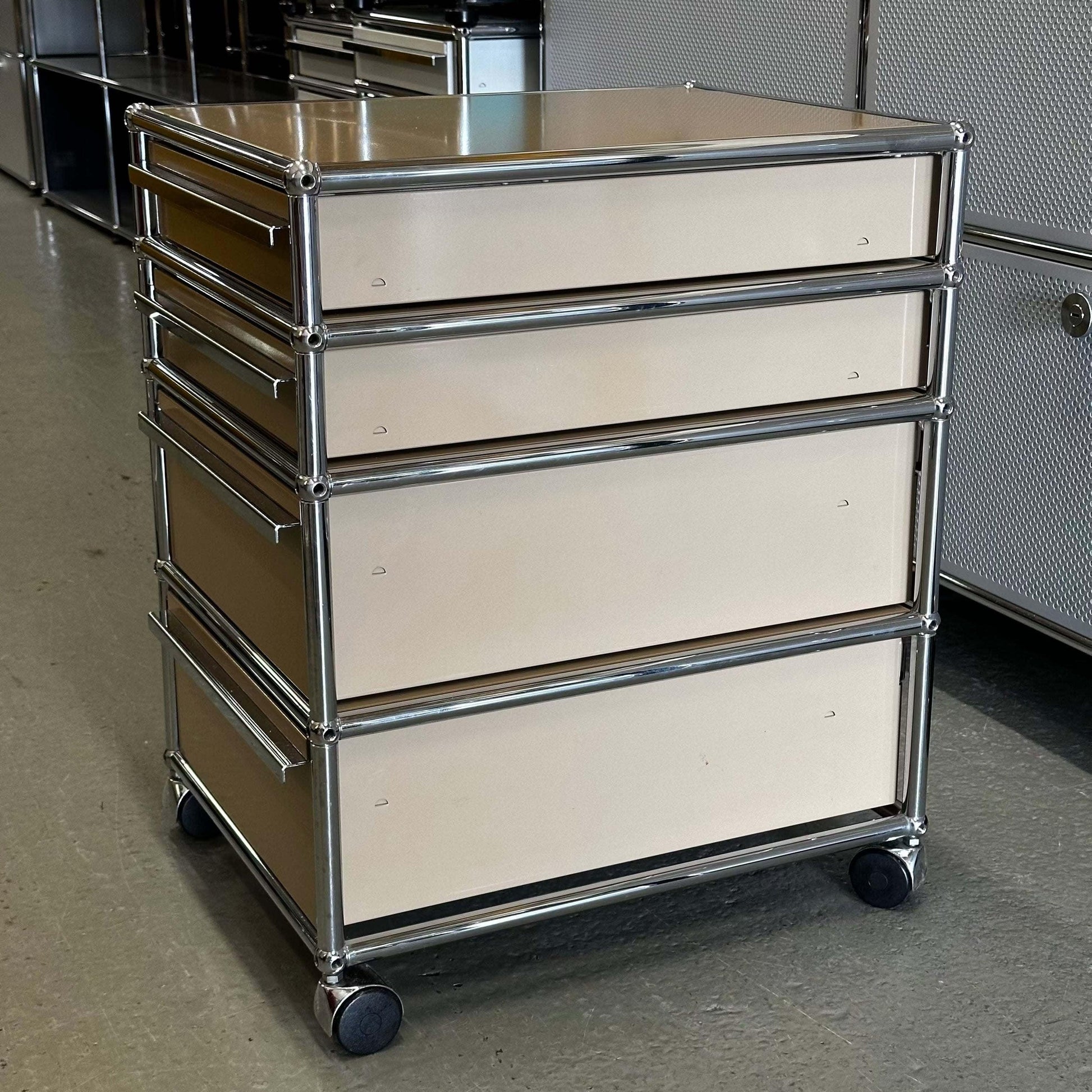 USM Haller beige rollcontainer with four drawers and chrome frame on wheels