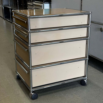 USM Haller beige rollcontainer with four drawers and chrome frame on wheels